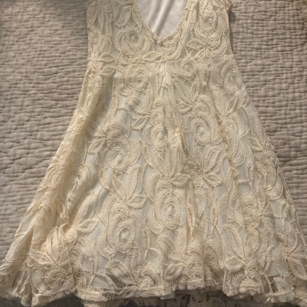 Perfect condition cream colored dress.